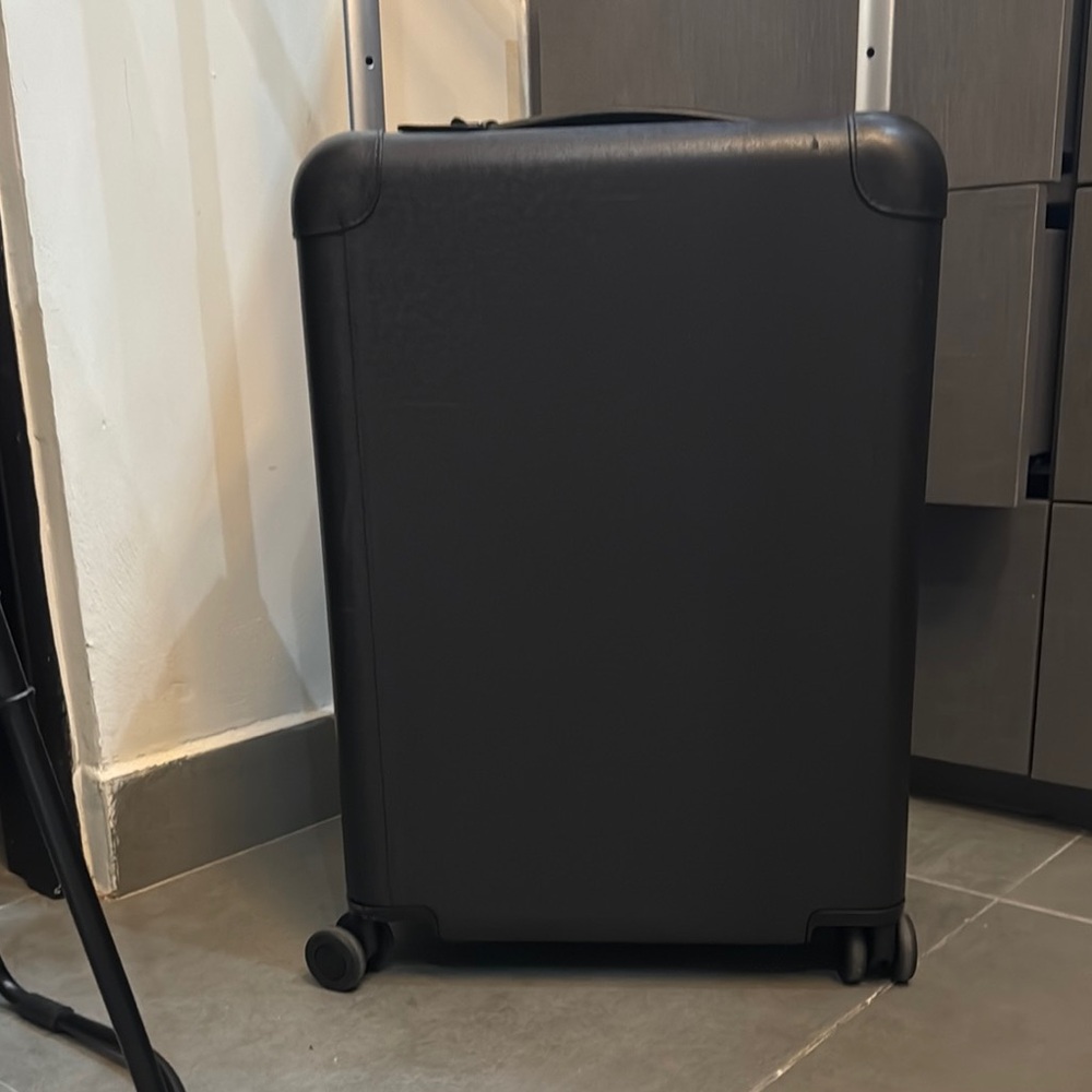 Louis Vuitton travel bag.
